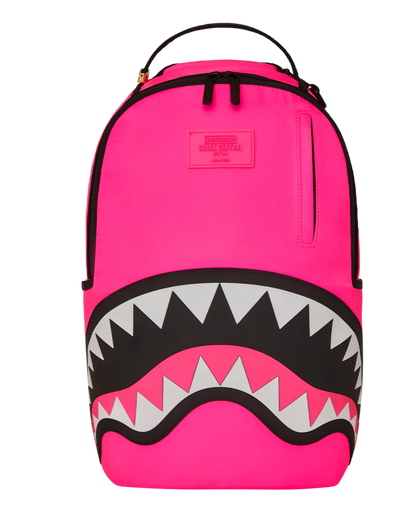 Pink backpack with shark mouth design on a white background