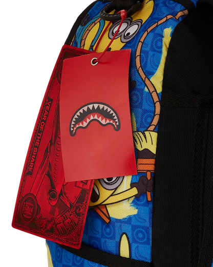 Colorful backpack with a red tag featuring a shark design on a white background