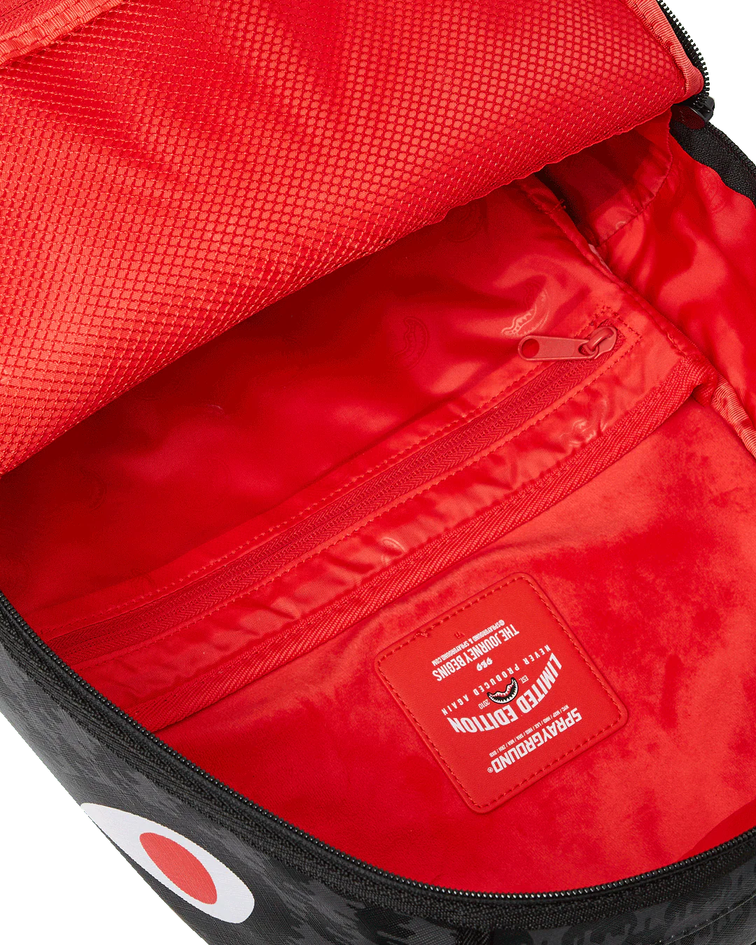 Red interior of a bag with a visible brand label