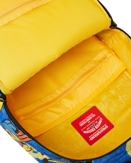 Yellow interior of a backpack with a colorful design and a red label.