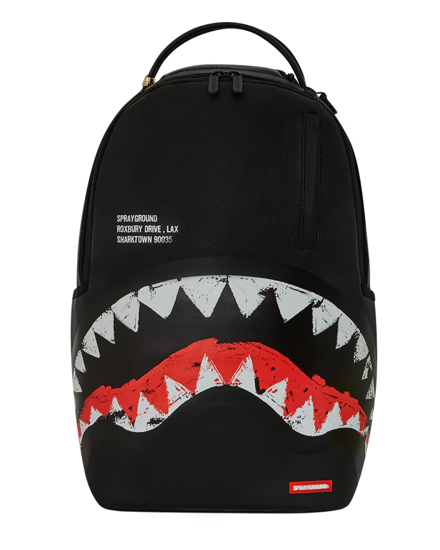 Black backpack with shark mouth design and visible branding on a white background