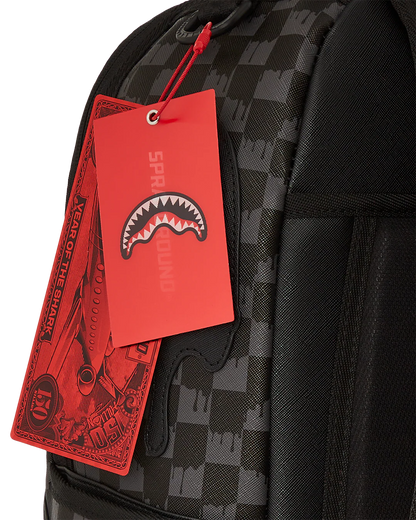 Black checkered backpack with a red tag featuring a shark logo on a white background