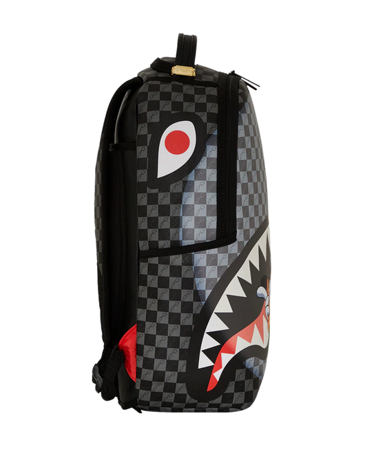 Backpack with checkered pattern and shark mouth design on a white background