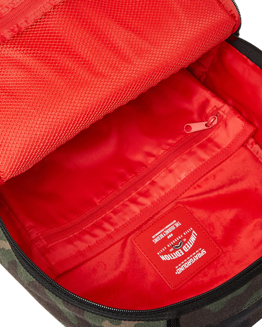 Red interior of a bag with a visible brand logo.