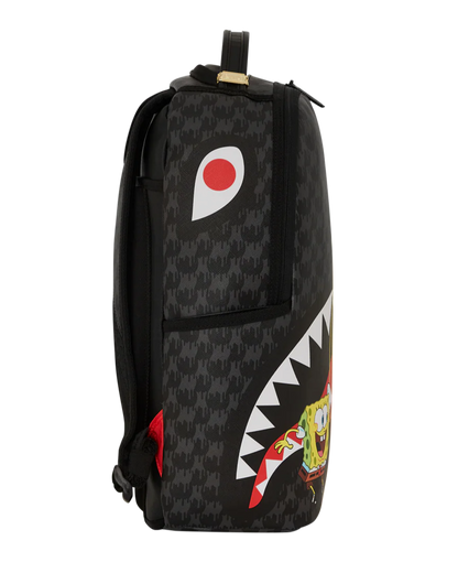 Black backpack with shark mouth design and colorful accents on a white background