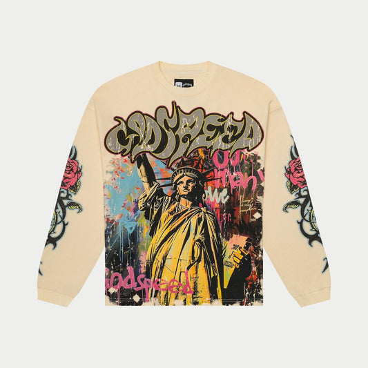 Beige sweatshirt with colorful graphic design featuring the Statue of Liberty and text on a white background